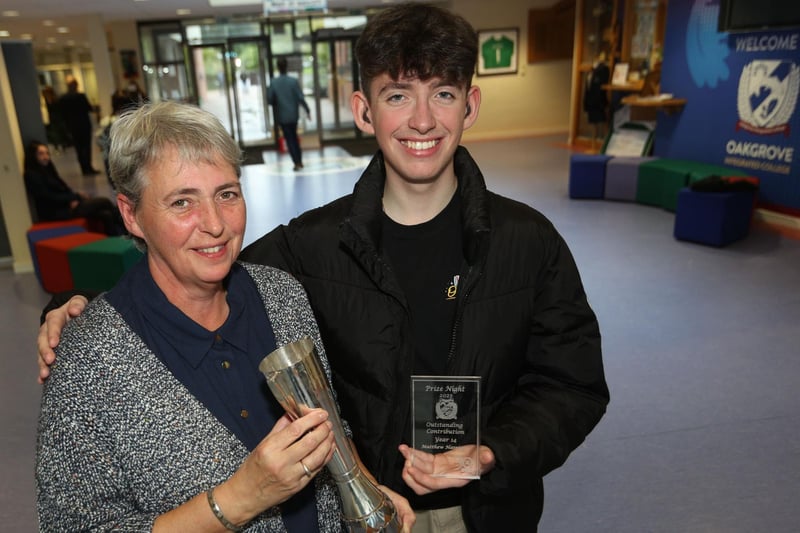 Student Matthew and his mum celebrate after he received the Board of Governor Cup for senior student who best represents the aims of Oakgrove College, after last week's prizegiving.
