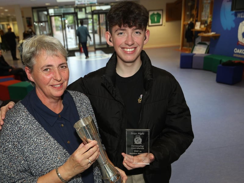 Student Matthew and his mum celebrate after he received the Board of Governor Cup for senior student who best represents the aims of Oakgrove College, after last week's prizegiving.