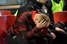 Derry City first team coach Andy Mitchell with his head in his hands.