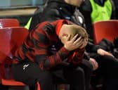 Derry City first team coach Andy Mitchell with his head in his hands.