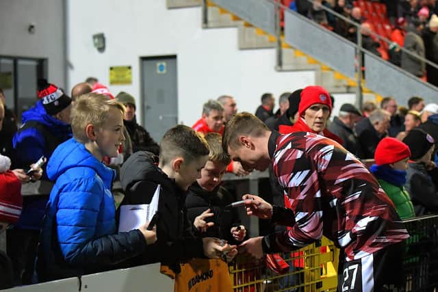 Daniel Kelly signs autographs before the game against Drogheda. Photograph: George Sweeney