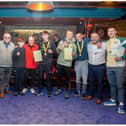 St Joseph's clinched the Best Team award at the Ulster Senior/Intermediate championships in Belfast. Pictured, left to right are, Cahir Duffy, Liam McLaughlin, Eugene Duffy (President of Derry Board and Vice President ABA), Cahir Og Duffy, Roy Nash, Fionn Duffy, Jack Barr, Nathan Harkin, Kevin Duffy (Ulster President) and Conor Young. Photos by Peter McKane.