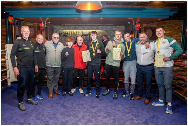 St Joseph's clinched the Best Team award at the Ulster Senior/Intermediate championships in Belfast. Pictured, left to right are, Cahir Duffy, Liam McLaughlin, Eugene Duffy (President of Derry Board and Vice President ABA), Cahir Og Duffy, Roy Nash, Fionn Duffy, Jack Barr, Nathan Harkin, Kevin Duffy (Ulster President) and Conor Young. Photos by Peter McKane.
