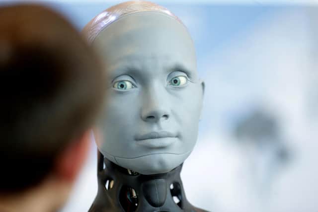 Human shaped robot interacts with visitors in Geneva, Switzerland at a UN summit to discuss artificial intelligence in its potential for empowering humanity. (Photo by Johannes Simon/Getty Images)
