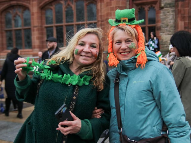 Olha and Svitlana smile for the photographer on St. Patrick’s Day in the Guildhall Square. (Photo - Deirdre Heaney, nwpresspics)