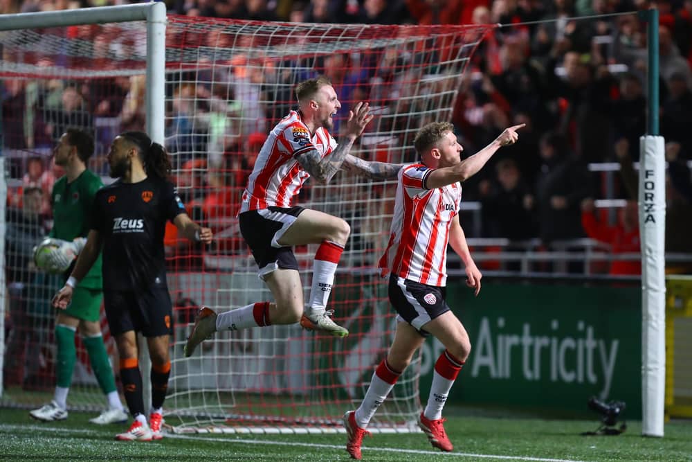 Ronan Boyce and Carl Winchester celebrate Derry City's equaliser against Cork City in front of the North Stand.