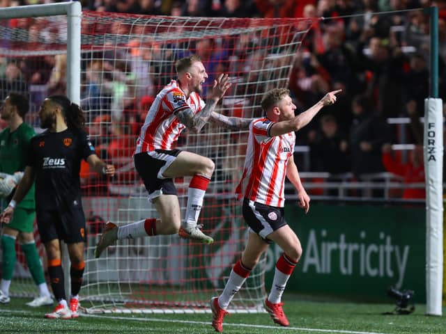 Ronan Boyce and Carl Winchester celebrate Derry City's equaliser against Cork City in front of the North Stand.
