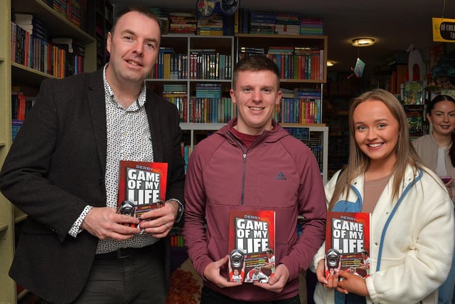 Journalist Michael McMullan pictured with Eoghan Kennedy and Saoirse Clarke at the launch of his new Derry GAA Book ‘Game of my Life’, in the Little Acorns Book Store, on Saturday morning. Photo: George Sweeney