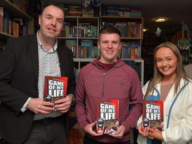 Journalist Michael McMullan pictured with Eoghan Kennedy and Saoirse Clarke at the launch of his new Derry GAA Book ‘Game of my Life’, in the Little Acorns Book Store, on Saturday morning. Photo: George Sweeney
