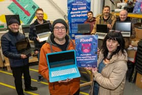 Caroline McGuinness from  Repair and Share Foyle in Rathmore Business Park pictured with Brad Dickinson, Tech Technician, and some of the laptops that have been donated, cleaned, boxed and ready to be given out to people with volunteers, Dennis Golden, Ryan McDaid, (Ryan’s Repairs), Andrew Kane, Thomas Mrkvicka and Antony Bradley. Picture Martin McKeown. 18.02.25