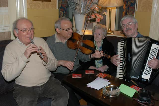 Risteard Mac Gabhann, on right, with Pádraig Ó Mianáin, Tony Mullan and Mary Ellen O'Doherty during Mary's 99th birthday celebrations in The Derby Bar in 2007.