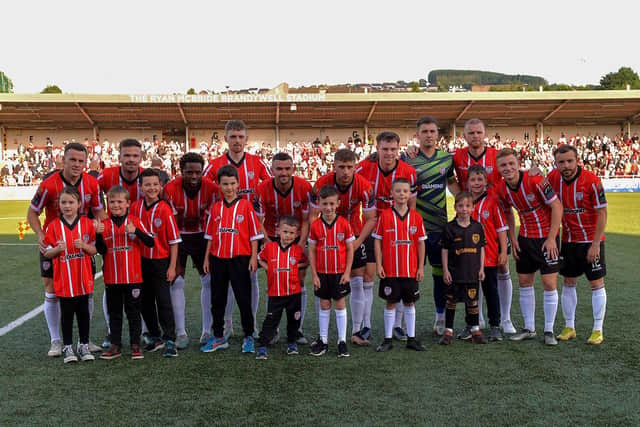 Mascots pictured with the Derry City starting eleven against Sligo Rovers at the Brandywell on Friday evening. Photo: George Sweeney. DER2327GS - 083
