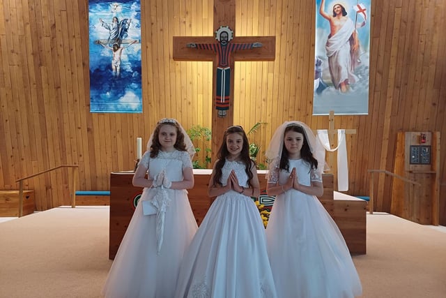 Culmore Primary School pupils Brooke Kelly, Kyra Martin and Emily-Mae Furey, who made their First Holy Communion on May 20 at Our Lady of Lourdes Chapel, Steelstown.  Fr Clerkin led the ceremony and the pupils' teacher is Mrs Mary Nash.