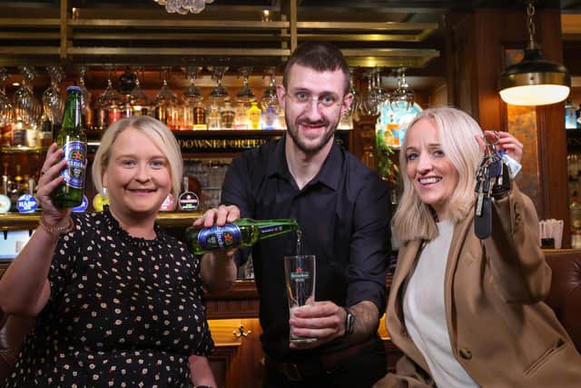 DRIVING HOME FOR CHRISTMAS: With the Christmas party season fast approaching, Craigavon-based drinks distributor United Wines has launched details of its festive Designated Driver campaign to help Northern Ireland revellers enjoy the party season and get home safe. Starting from November 18, the initiative will see partygoers who volunteer themselves as a designated driver rewarded with a free Heineken®0.0 or Birra Moretti Zero when they make themselves known to bar staff by showing their car keys at participating venues. Launching the safe driving campaign are Gemma Herdman (left) and Maura Bradshaw of United Wines, with Willy Erwin of The Lansdowne on Antrim Road, Belfast.
