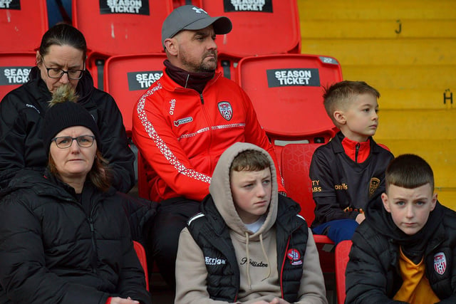 These Derry City fans are deep in concentration at the game against Finn Harps. Photo: George Sweeney. DER2305GS – 10