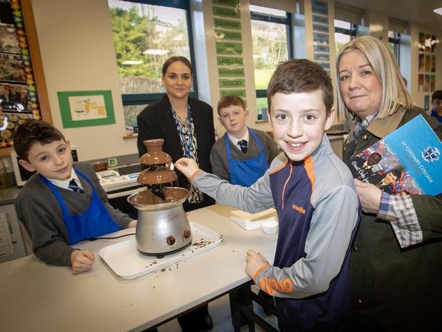 CHOCOLATE FOUNTAIN. . . .Enjoying the chocolate fountain in the HE Department during St. Columb's College Open Day is Daragh Wilson, St. Patrick's PS and his mum Paula.