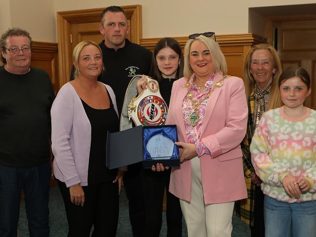 Mayor Sandra Duffy makes a presentation to 13 years old Annie Murphy, winner of the WKU Pro-Am World Kick-boxing title at a civic reception held in the Mayor’s Parlour. Included are mum Michelle, dad Gareth and wee sister Charlene. Also include are grandparents Cathy and Paul McKeever. (Photo - Tom Heaney, nwpresspics)