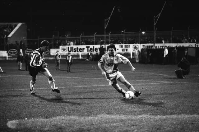 Dónal O'Brien closes down Michael Hughes.