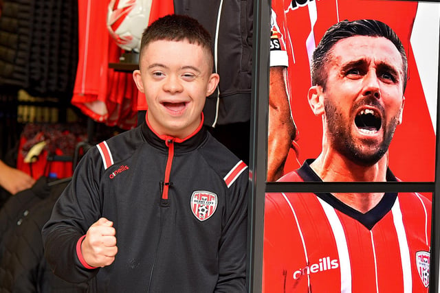 Number one fan Adam Morrison records a good luck video message for the Derry City team at O’Neill’s Sports store ahead of their FAI Cup final against Shelbourne.  DER2244GS – 107