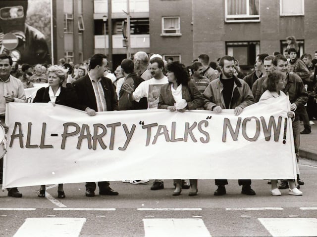 Sinn Féin's Martin McGuinness, Mary Nelis and other party members leading protests calling for all party peace talks.