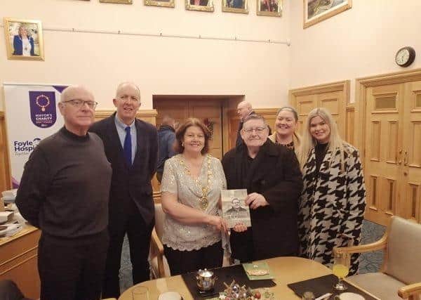 Mayor patricia Logue pictured with Tony Hassan and guests during a visit to the Guildhall to present a copy of his book back in December 2023.