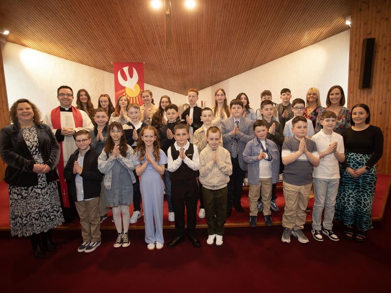 Pupils from Oakgrove Integrated Primary School pictured after receiving the Sacrament of Confirmation from Fr. Lagan at St. Oliver Plunkett Church, Strathfoyle on Friday last. Included in photo is Mrs Ashley Donaghey, Principal, Ms. Clare Lally, Mrs. Natalie Rosborough, Miss Zoe Kivelehan, Miss Zoe Gregg (Photos: Jim McCafferty Photography)
