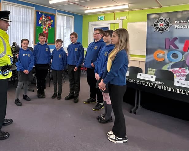 The Judges - Primary 7 pupils from Artigarvan Primary School - with Superintendent John Wilson following the session.