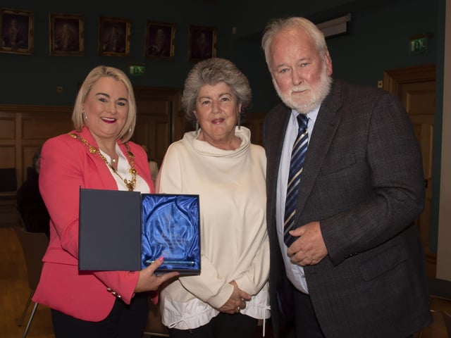 The Mayor of Derry City and Strabane District Council, Sandra Duffy making a presentation to former Derry Journal editor Pat McArt at the Guildhall on Wednesday evening, in recognition of his contribution and commitment to journalism in the city and district. Centre is Pat’s wife Rosie.