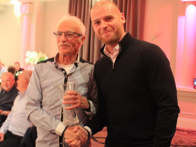 Gang of Four member and ex-Derry centre half Tony O'Doherty receives his awards from current City captain Mark Connolly