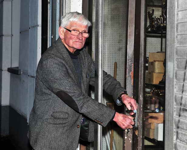 Soccer legend, eighty-six year old John ‘Jobby’ Crossan closes the door, for the final time, on his Sports Centre in Pennyburn on Friday. Photo: George Sweeney