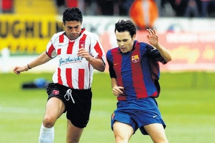 Peter 'Pizza' Hutton challenges Andrés Iniesta