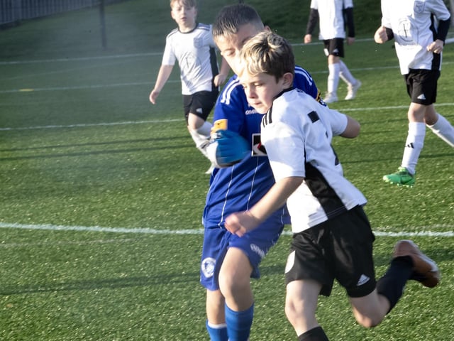 A battle for possession during Saturday's 2015s Sean O'Kane Memorial Cup between Letterkenny Rovers and Trojans at St. Joseph's Boys School.