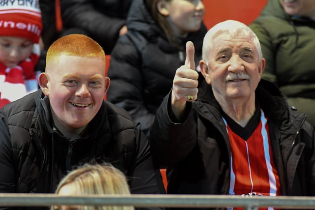 Our photographer gets the thumbs up from these Derry City fans at the Presidents Cup final at Brandywell on Friday evening. Photo: George Sweeney. DER2307GS – 100