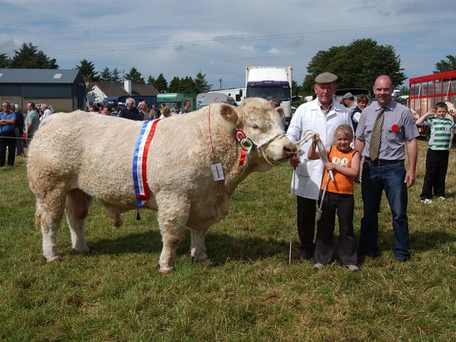 Irwin McCandless, winner of the overall Charolais cow  at the Carndonagh show, Included are Eimear McGovern and Sean McGovern.