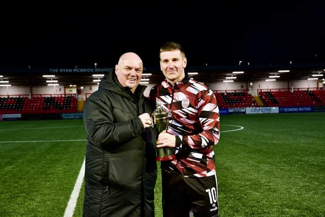 Paul Kee presents Derry City captain Patrick McEleney with the Billy Kee Memorial Cup. Photograph by Kevin Morrison.