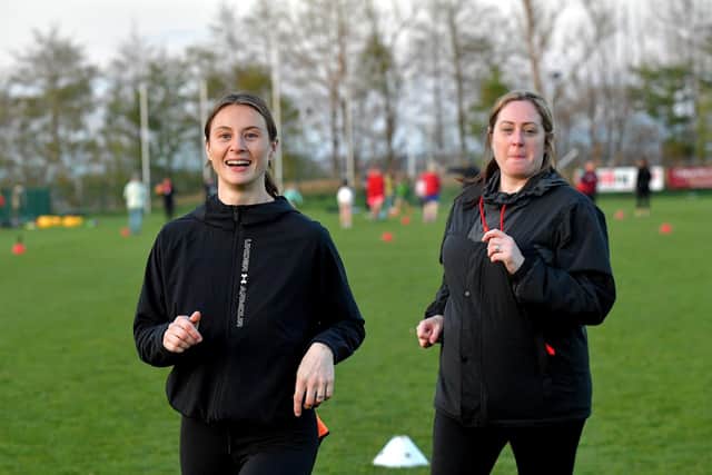 Warm-up exercises ahead of Doire Trasna’s first Mothers and Others football practice session, at Corrody Road. Photo: George Sweeney. DER2316GS – 16