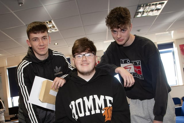 Matthew McGeehan, Dylan McClements and Damian McKane checking over their A Level results at St. Joseph's Boys School on Thursday morning at the school.