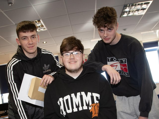 Matthew McGeehan, Dylan McClements and Damian McKane checking over their A Level results at St. Joseph's Boys School on Thursday morning at the school.