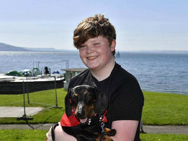 Milo with Tristen Crumlish at the Moville Summer Festival Pet Show, held on The Green. Photo: George Sweeney
