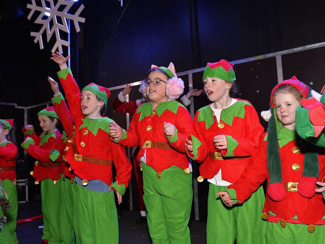 Pupils from Culmore Primary School sing Christmas carols at the Culmore Community Hub on Friday night. Photo: George Sweeney