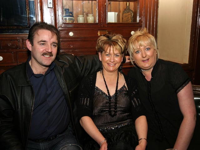 Birthday girl Dolly smiles for the camera with friends John and Paula 0049JML