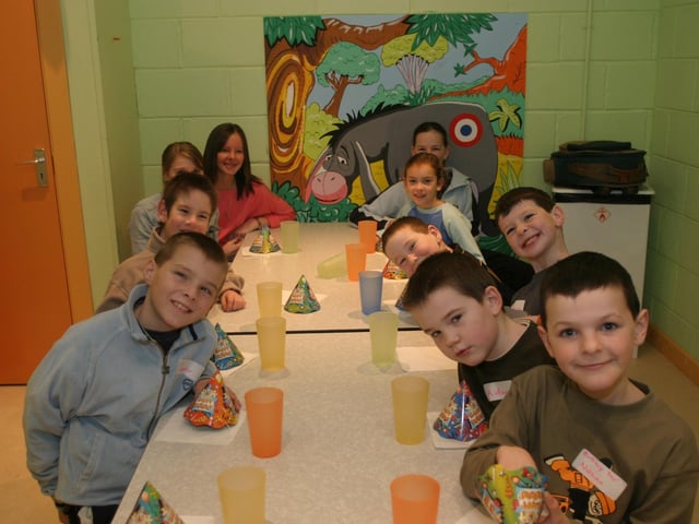 Nathan surrounded by his party guests at the Fun Factory.:Parties and nights out in Derry and Donegal in December 2003.