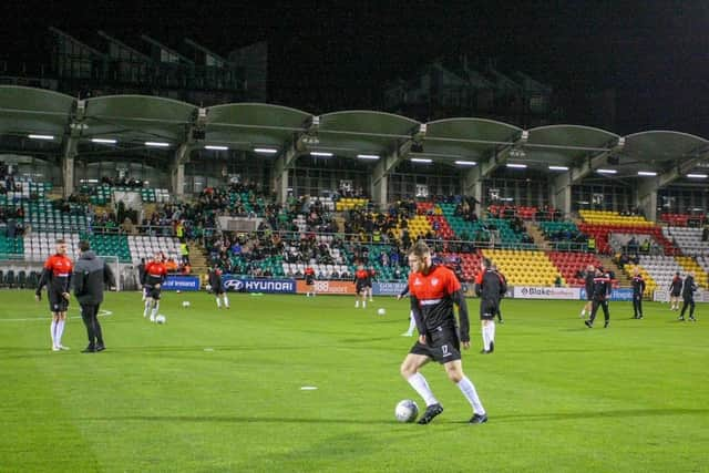 Derry City players warm-up in Tallaght Stadium ahead of Sunday night's defeat to Shamrock Rovers.