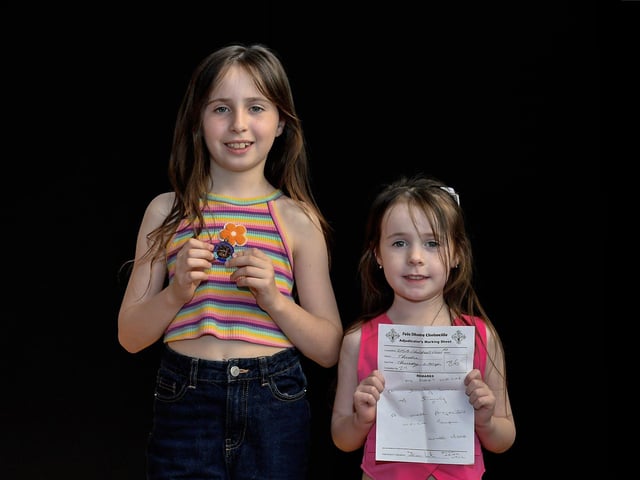 Kate McGinley, pictured with her sister Isla achieved third place P5 Girls Poem at Feis Dhoire Cholmcille. Photo: George Sweeney