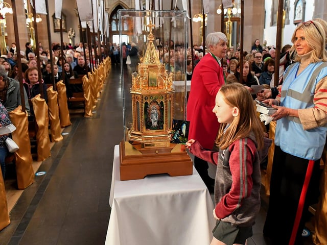 Pupils from the Derry Diocese queue for the veneration of the relics of St Bernadette at St Eugene’s Cathedral on Monday morning. Relics of the saint are being taken on pilgrimage to each of the 26 Catholic dioceses in Ireland. Photo: George Sweeney