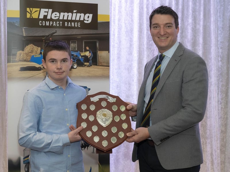 Newbuildings' Lewis Campbell receives the League 4 Bowling Award from Peter McCartney, NW Cricket General Manager.