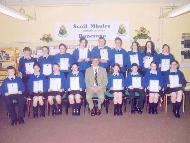 Liam Rainey, principal of Scoil Mhuire, with pupils who received junior cert awards at the annual school prizegiving. (2005MG09)
