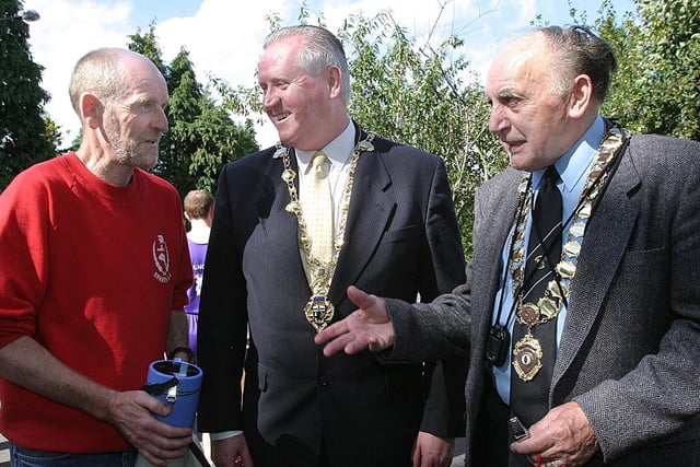 Gerry Lynch, one of the race organisers, talking to the Mayor of Derry Councillor Shaun Gallagher, and Eddie Wilson, president of the Northern Ireland Athletics Federation, at the start of the Gee's Waterside Half-Marathon. (1609T31).:.