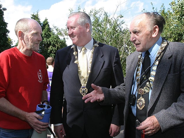 Gerry Lynch, one of the race organisers, talking to the Mayor of Derry Councillor Shaun Gallagher, and Eddie Wilson, president of the Northern Ireland Athletics Federation, at the start of the Gee's Waterside Half-Marathon. (1609T31).:.