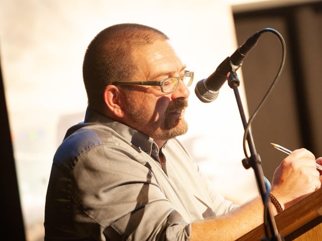 Colm Barton speaking fondly of his late mother Roisin during Sunday's Féile event in An Cultúrlann.